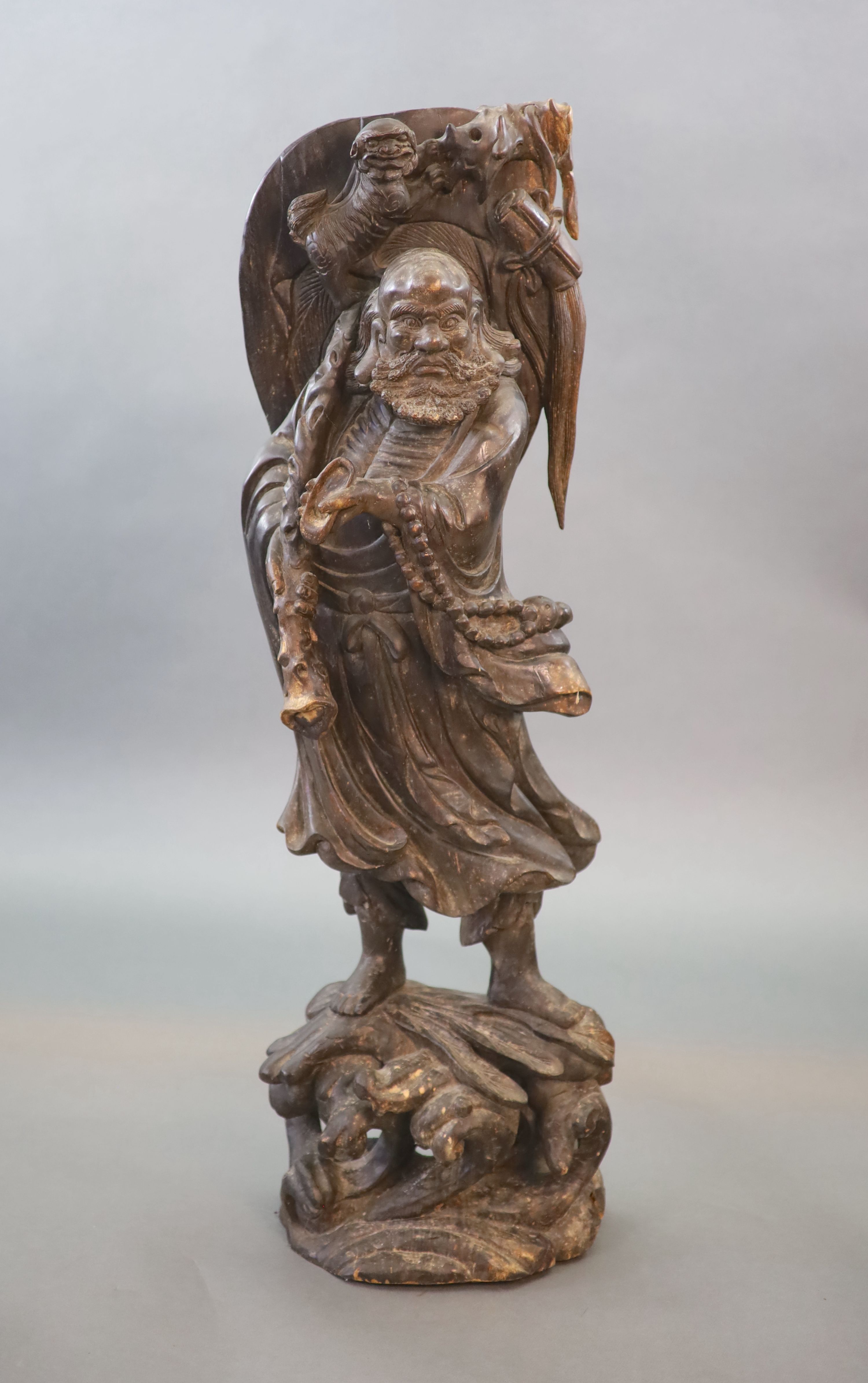 An early 20th Chinese carved hardwood figure of a Luohan